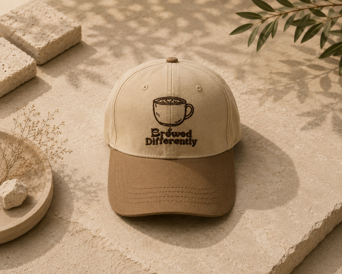 Embroidered coffee cap with Brewed Differently design in beige and brown
