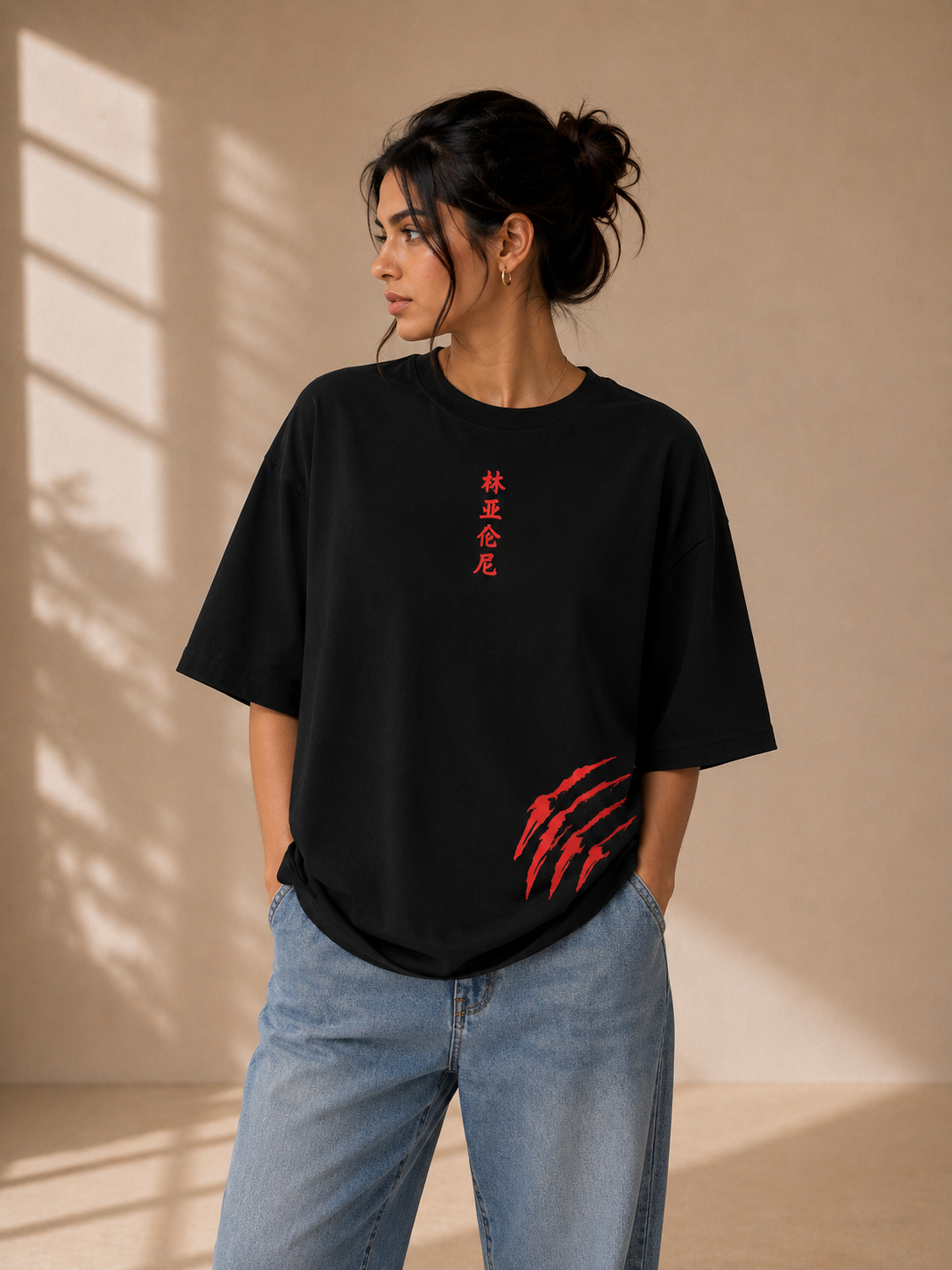 Black oversized graphic T-shirt with red claw mark and Japanese-inspired front print