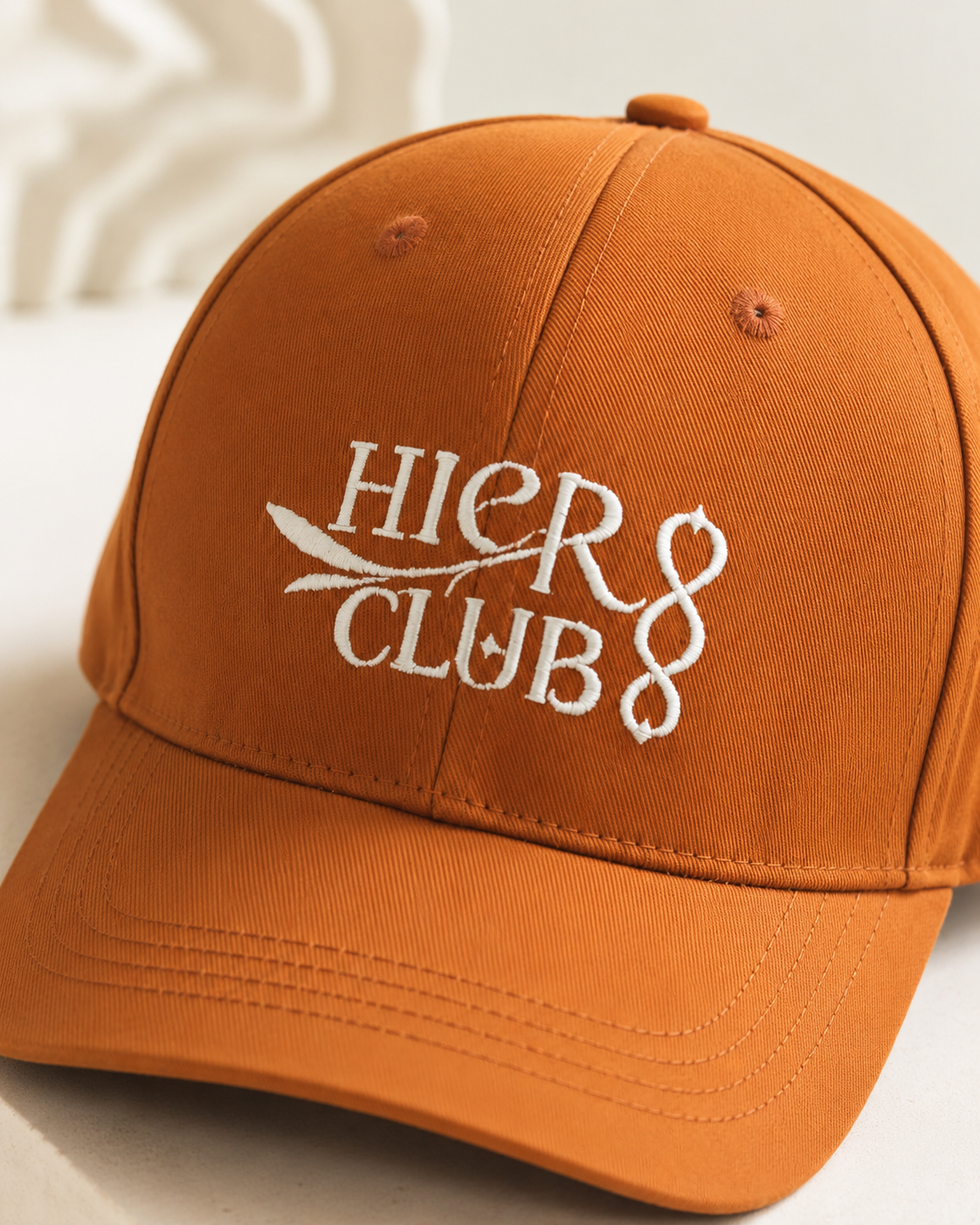 Rust brown embroidered baseball cap with HIER CLUB logo